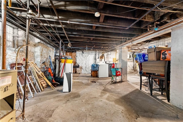 unfinished basement featuring washer and clothes dryer