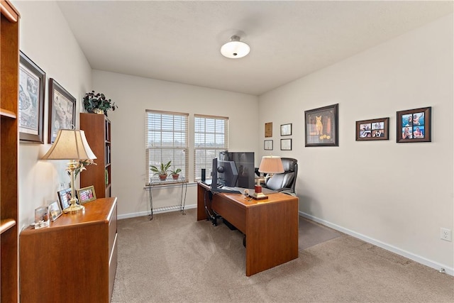 office featuring light carpet and baseboards