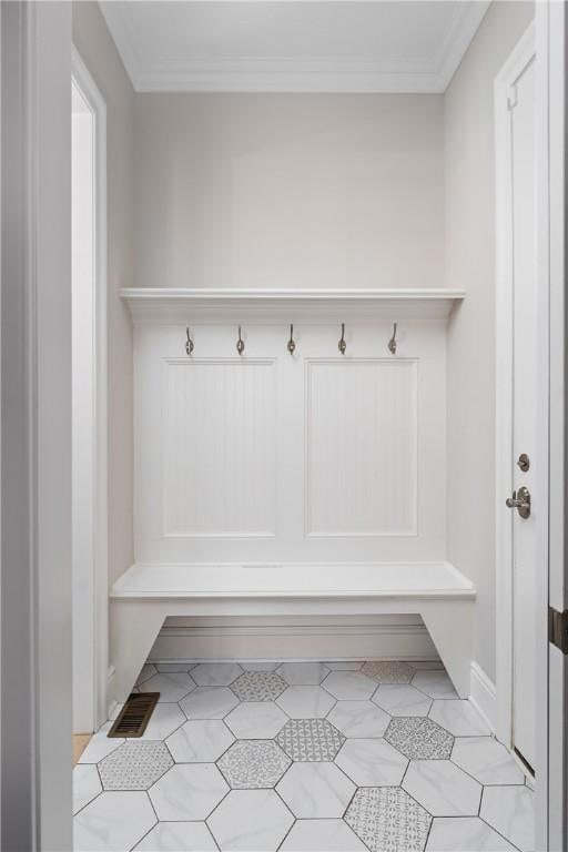 mudroom featuring ornamental molding and visible vents