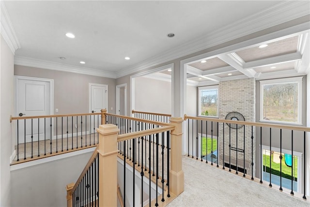 hall featuring carpet floors, beam ceiling, ornamental molding, an upstairs landing, and coffered ceiling