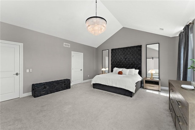 bedroom with vaulted ceiling, light carpet, and visible vents