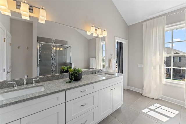 full bath featuring lofted ceiling, a wealth of natural light, and a sink