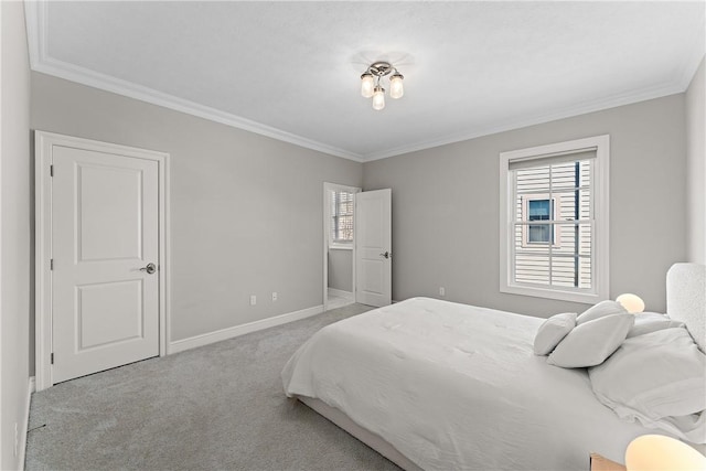 bedroom featuring baseboards, carpet flooring, and crown molding