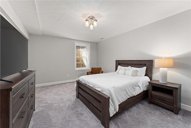 carpeted bedroom with baseboards