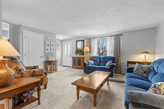 carpeted living room with baseboards and a textured ceiling