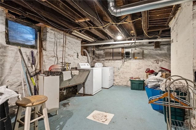 unfinished basement featuring independent washer and dryer