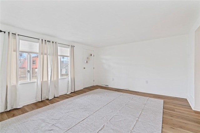 spare room with light wood-style flooring