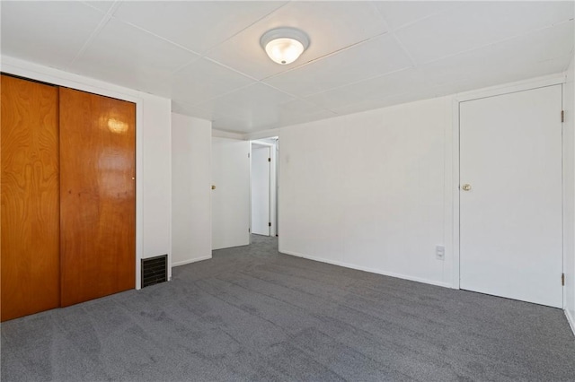 unfurnished bedroom featuring carpet floors and visible vents