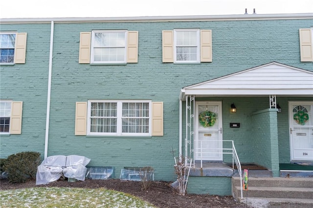 view of property with brick siding