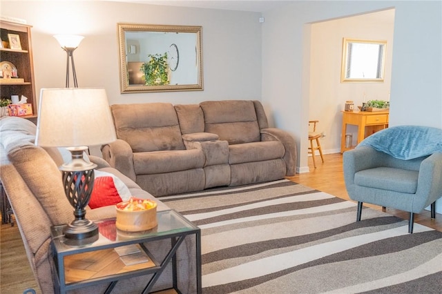 living area with wood finished floors and baseboards