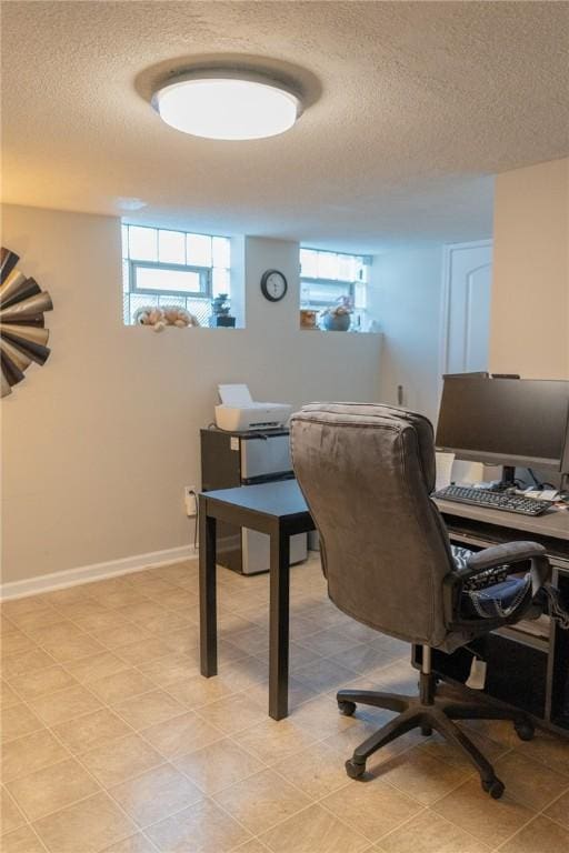 office area with a textured ceiling