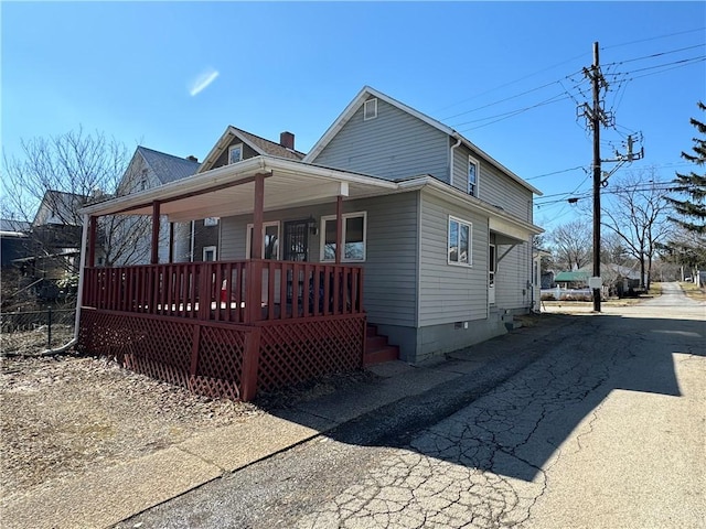 exterior space with crawl space and covered porch