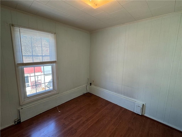 empty room featuring dark wood-type flooring