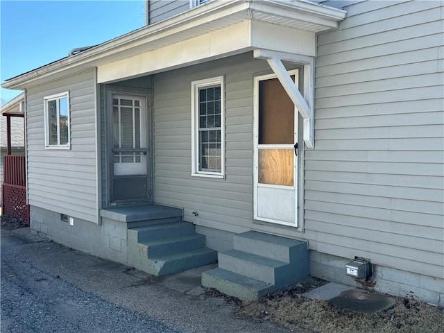 view of exterior entry with crawl space