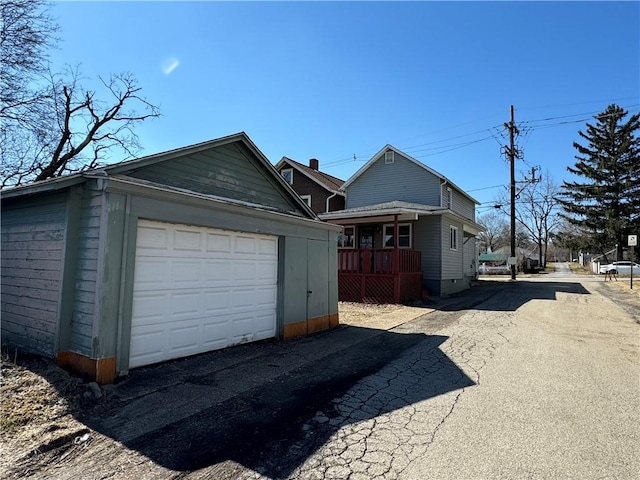 exterior space featuring aphalt driveway