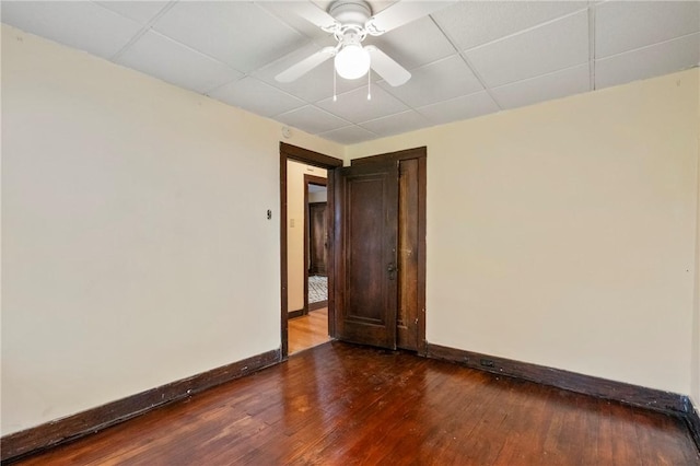 7807 Union Ave, Swissvale, PA 15218 - empty room with dark wood-style floors, a drop ceiling, and ceiling fan