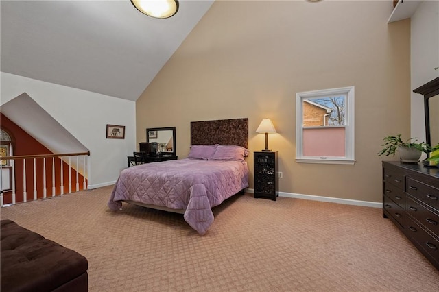 bedroom featuring light carpet, high vaulted ceiling, and baseboards