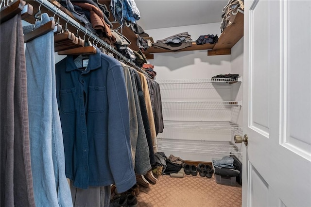 spacious closet with tile patterned floors