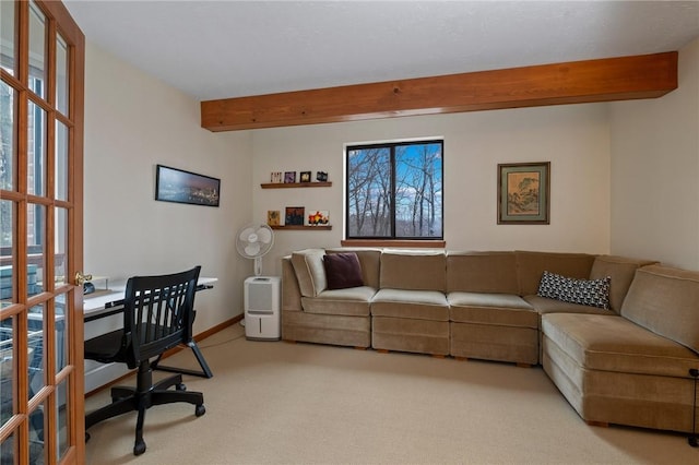 living room with baseboards, beam ceiling, and light colored carpet