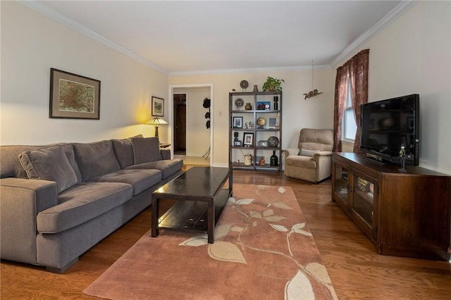 living room featuring ornamental molding and wood finished floors