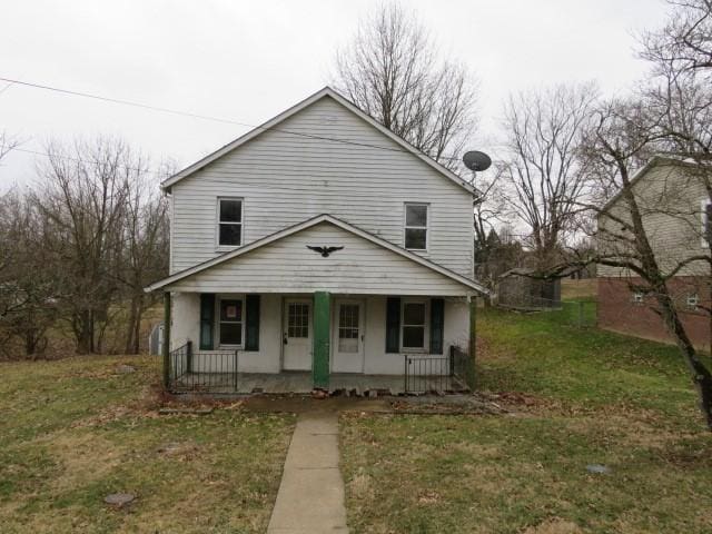 view of front of property with a front lawn and a porch