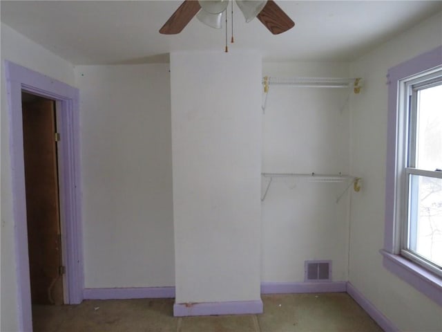 empty room with visible vents and baseboards