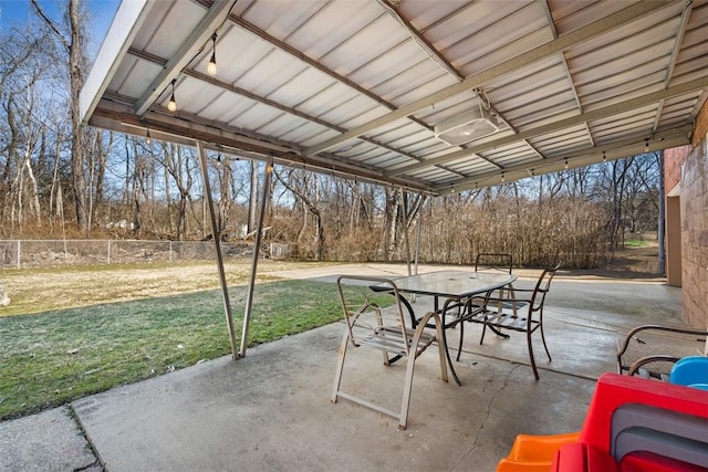 view of patio with fence and outdoor dining space