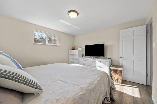 bedroom featuring wood finished floors