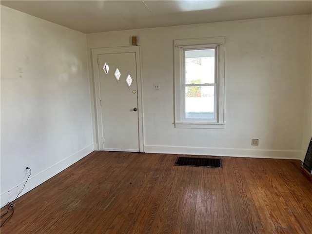 entryway featuring dark wood-style flooring, visible vents, and baseboards