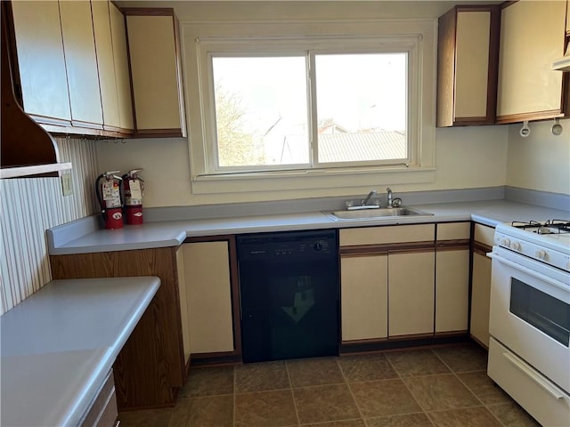 kitchen with black dishwasher, light countertops, a sink, and white range with gas stovetop