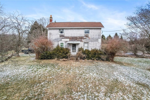 traditional home featuring a chimney