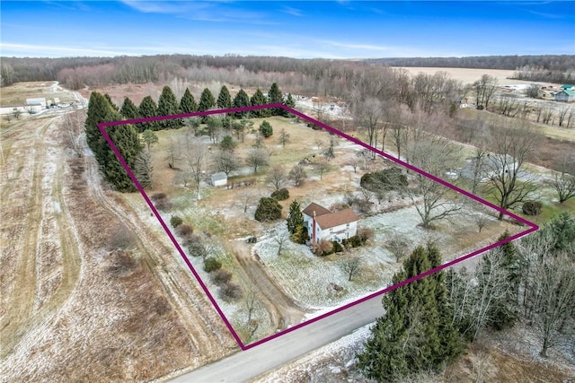 birds eye view of property with a rural view