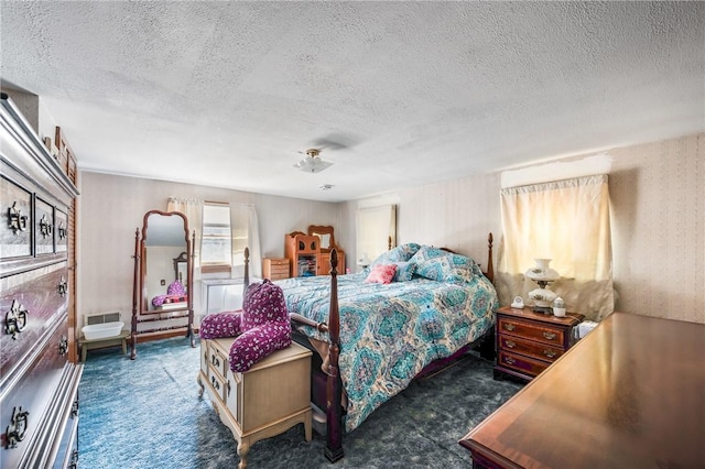 carpeted bedroom with a textured ceiling