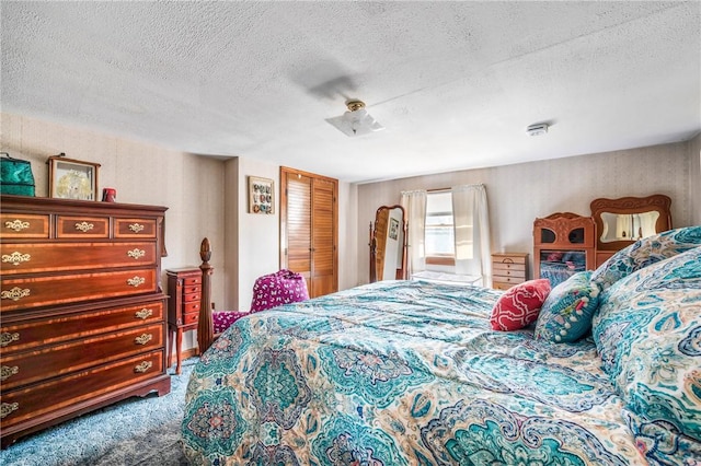 carpeted bedroom with a textured ceiling