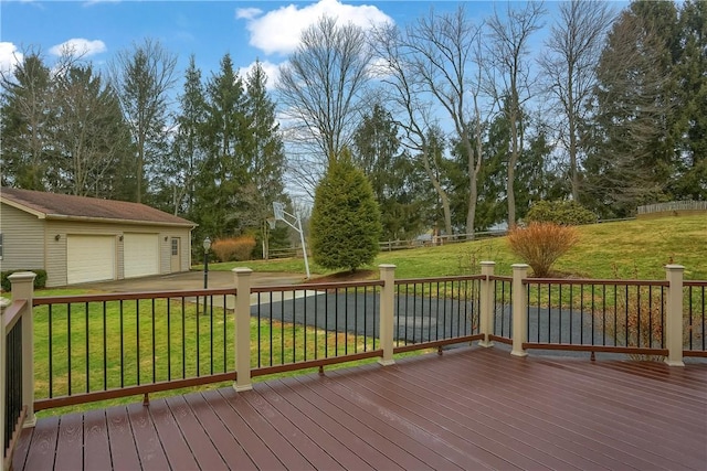 wooden deck with an outbuilding and a yard