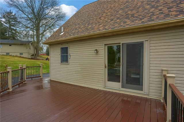 wooden terrace with a lawn