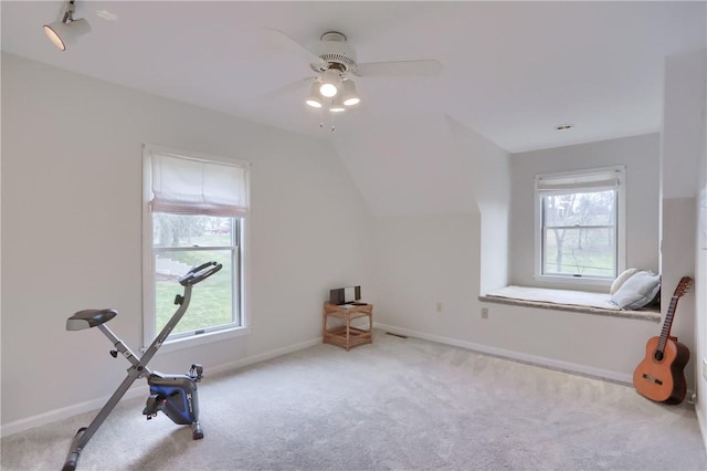 exercise room with carpet floors, ceiling fan, baseboards, and lofted ceiling