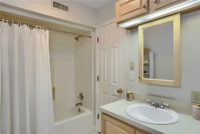 bathroom featuring vanity, visible vents, and shower / tub combo with curtain