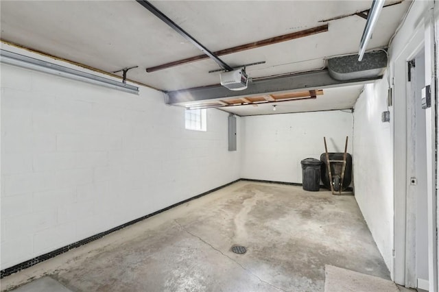 garage featuring electric panel and a garage door opener