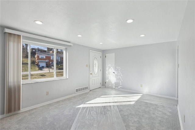 interior space with recessed lighting, visible vents, and baseboards