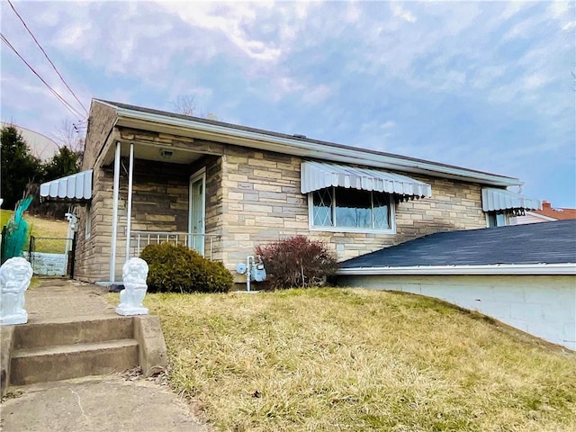 exterior space with stone siding