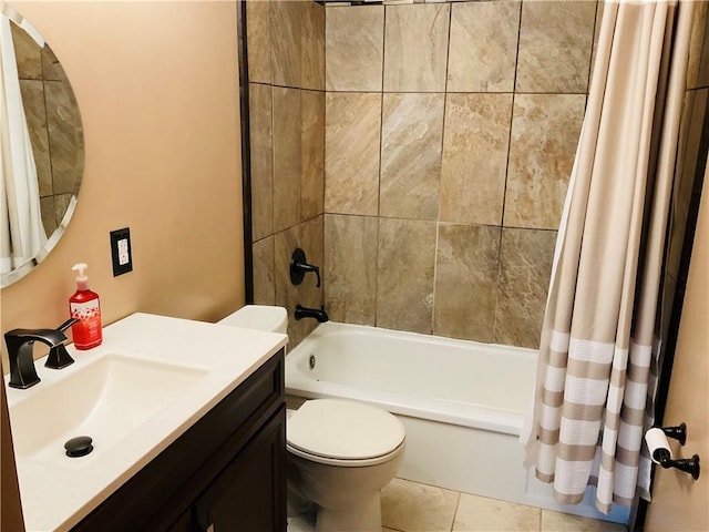 full bath featuring toilet, tile patterned floors, shower / bath combo, and vanity