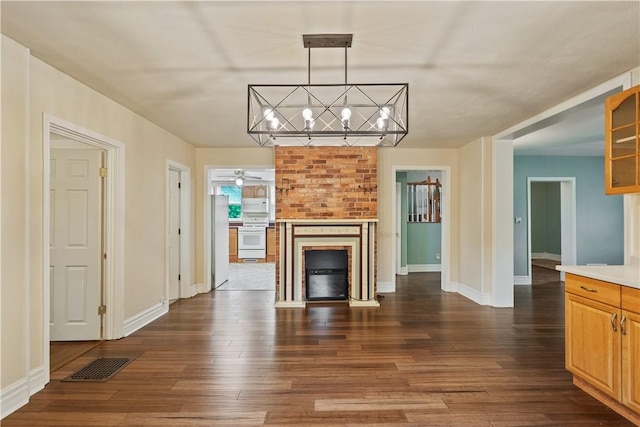 2101 Lonsdale St, Reserve, PA 15212 - unfurnished living room featuring dark wood-style floors, a ceiling fan, a brick fireplace, a chandelier, and baseboards