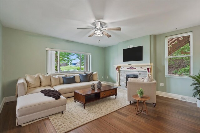 2101 Lonsdale St, Reserve, PA 15212 - living area with ceiling fan, healthy amount of natural light, a fireplace with flush hearth, and wood finished floors