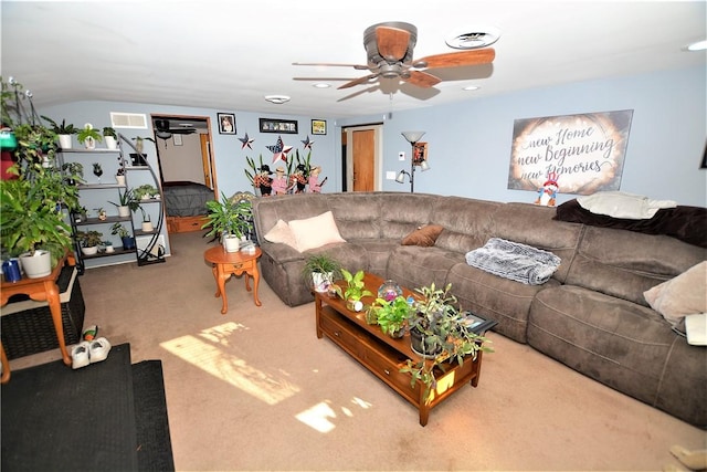carpeted living room featuring visible vents and a ceiling fan