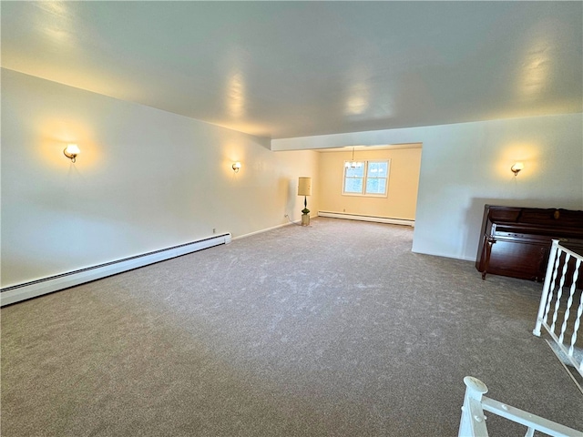 carpeted spare room featuring a baseboard radiator