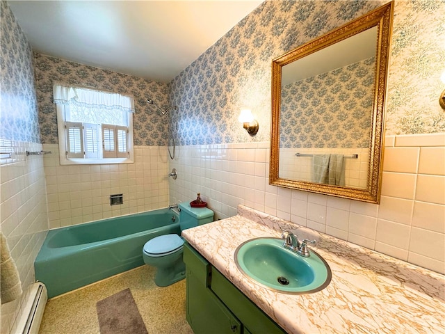 bathroom featuring a baseboard heating unit, wainscoting, tile walls, and wallpapered walls