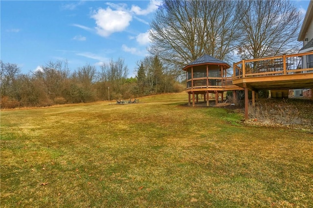 view of yard with a wooden deck