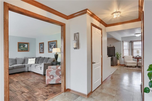 hallway with baseboards and crown molding