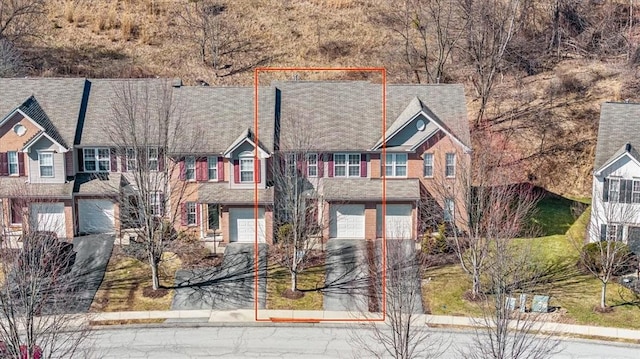 view of front of house with driveway and an attached garage